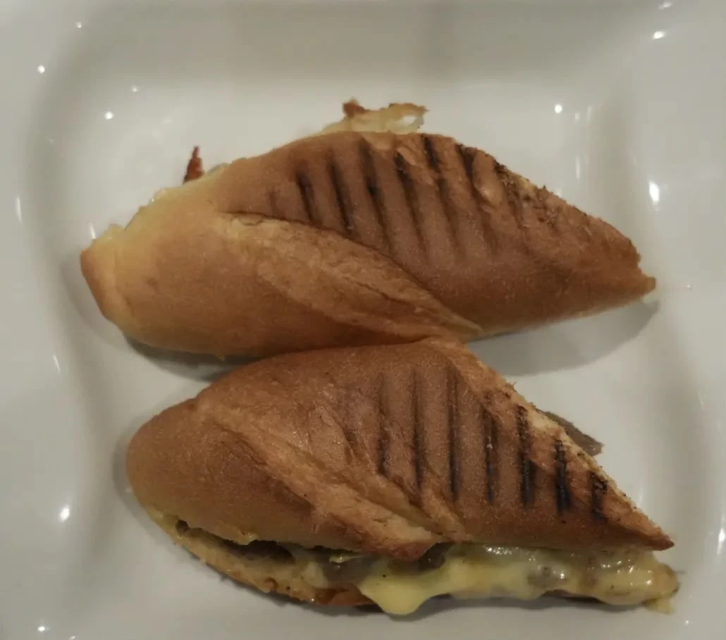 Philly Cheese Steak Sandwich bread stuffed with sautéed steak, onions & cheese